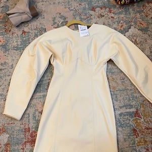 Cute neoprene dress. Very rich beige creams color.